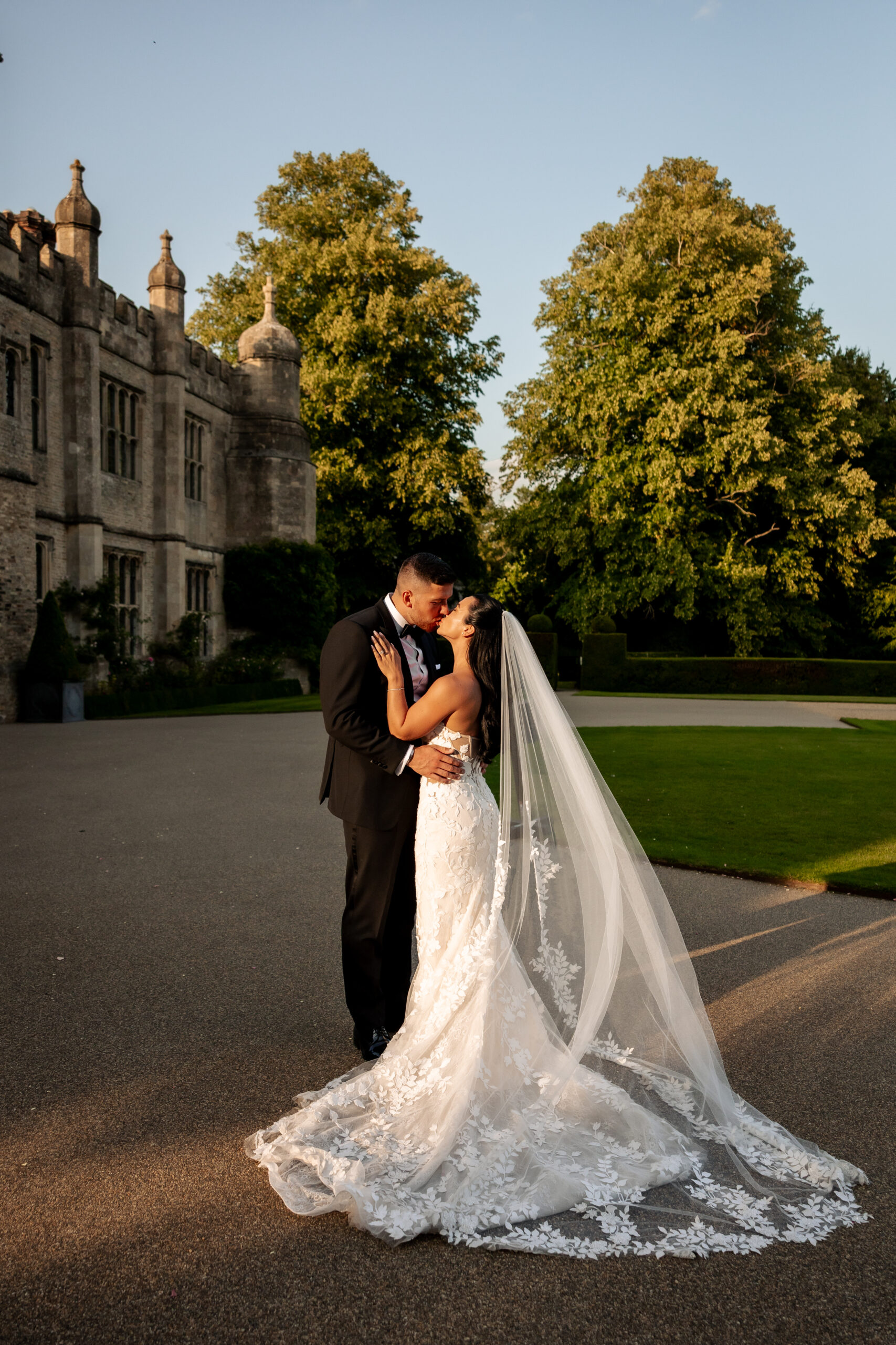 Sunset couple portraits in front of Hengrave Hall’s historic building